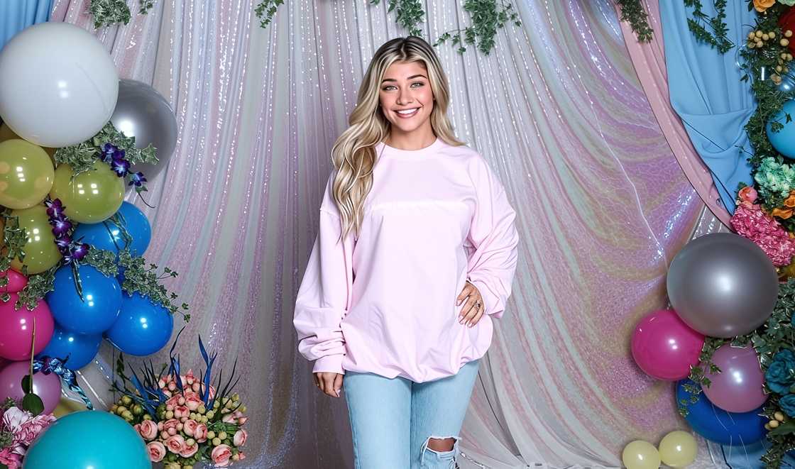 Gia Giudice poses against a colourful background with flowers and balloons. Gia Giudice poses against a colourful background with flowers and balloons.