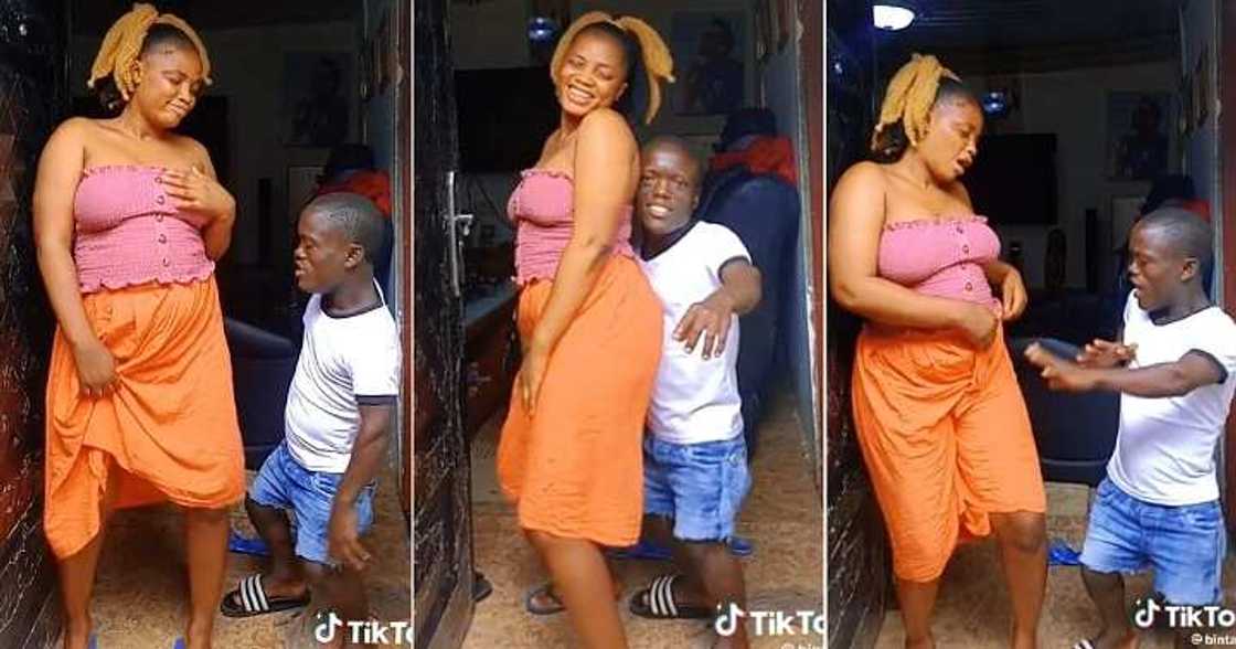 Lady dances with her small-sized man Lady dances with her small-sized man