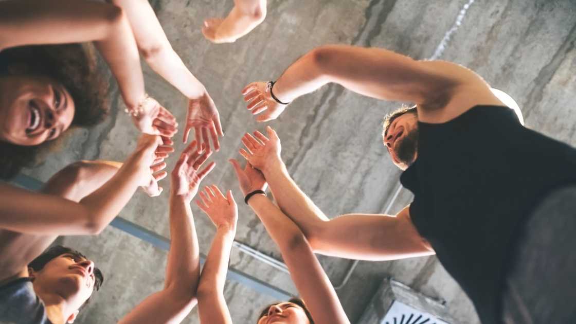 Friends high five in celebration.