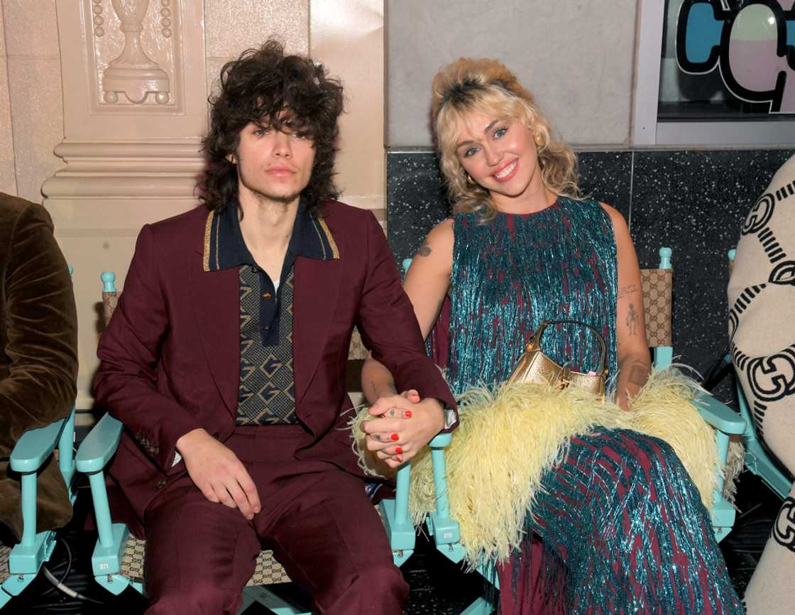 Maxx Morando and Miley Cyrus at the front row for Guicci Love Parade on Hollywood Blvd in Los Angeles Maxx Morando and Miley Cyrus at the front row for Guicci Love Parade on Hollywood Blvd in Los Angeles