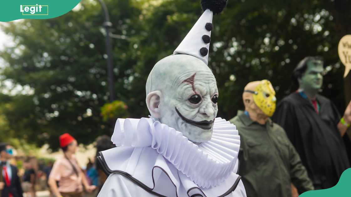A cosplayer dressed as Art the Clown from "Terrifier" in the 2023 Dragon Con Parade