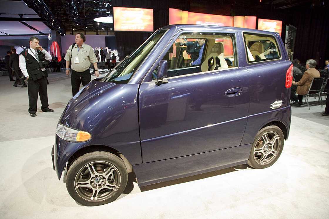 A navy blue Commuter Cars' Tango electric car on display A navy blue Commuter Cars' Tango electric car on display
