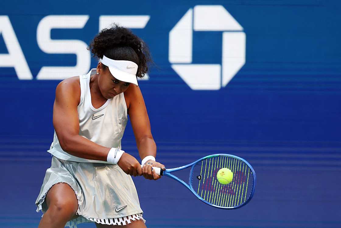 Naomi Osaka returns a shot against Elena Rybakina during their Women's Singles Fourth Round match Naomi Osaka returns a shot against Elena Rybakina during their Women's Singles Fourth Round match
