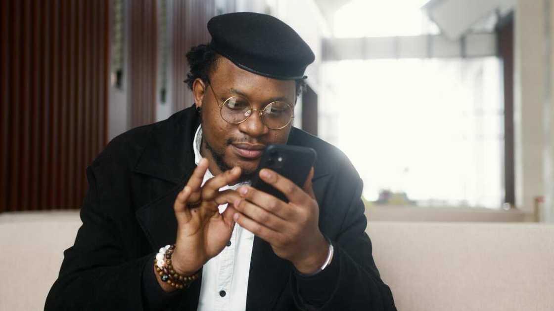 Man using a phone Man using a phone