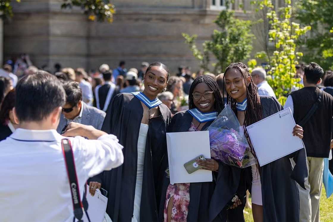 University of Toronto international students posing for a photo on their graduation day