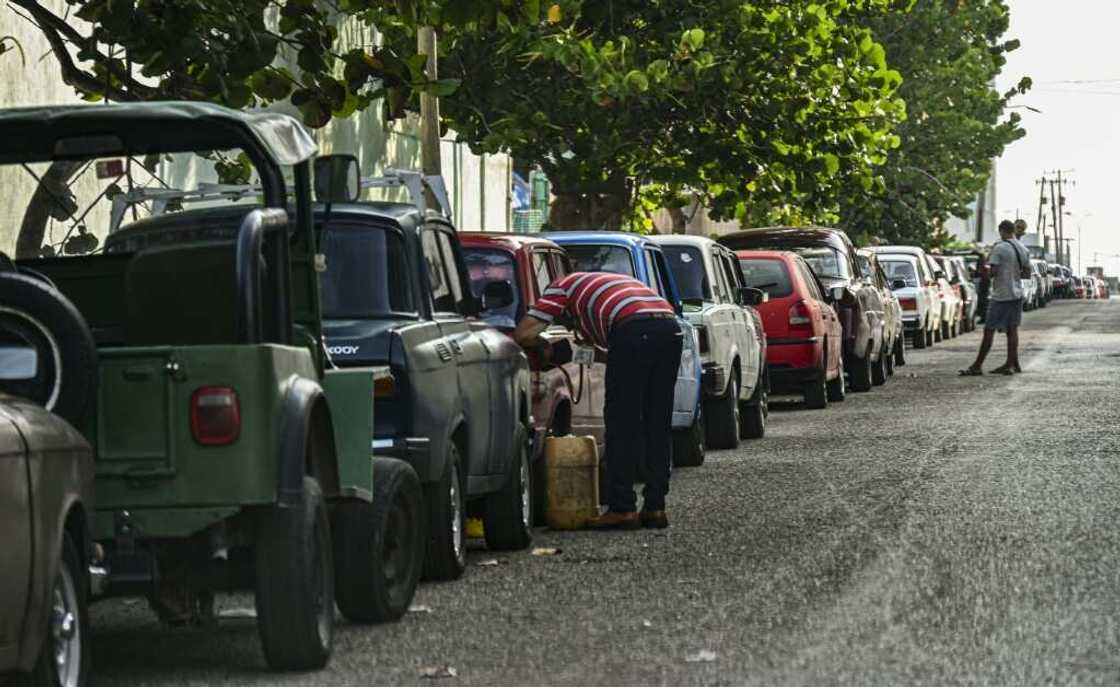 Cuban service stations have created WhatsApp groups to organize customers, who often have to queue down the block for a chance to get gasoline Cuban service stations have created WhatsApp groups to organize customers, who often have to queue down the block for a chance to get gasoline