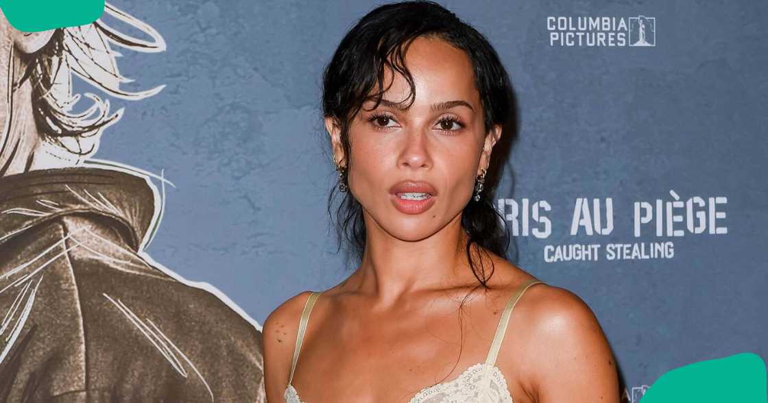 Zoë Kravitz poses on the red carpet in a cream satin slip dress Zoë Kravitz poses on the red carpet in a cream satin slip dress