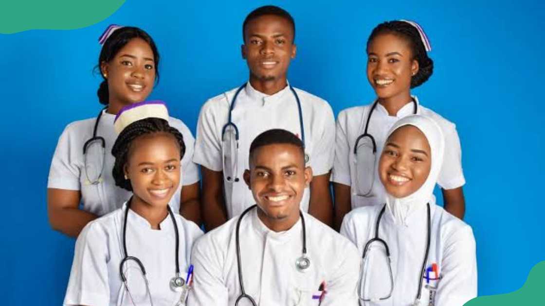 Emekuku School of Nursing students posing in a white uniform.