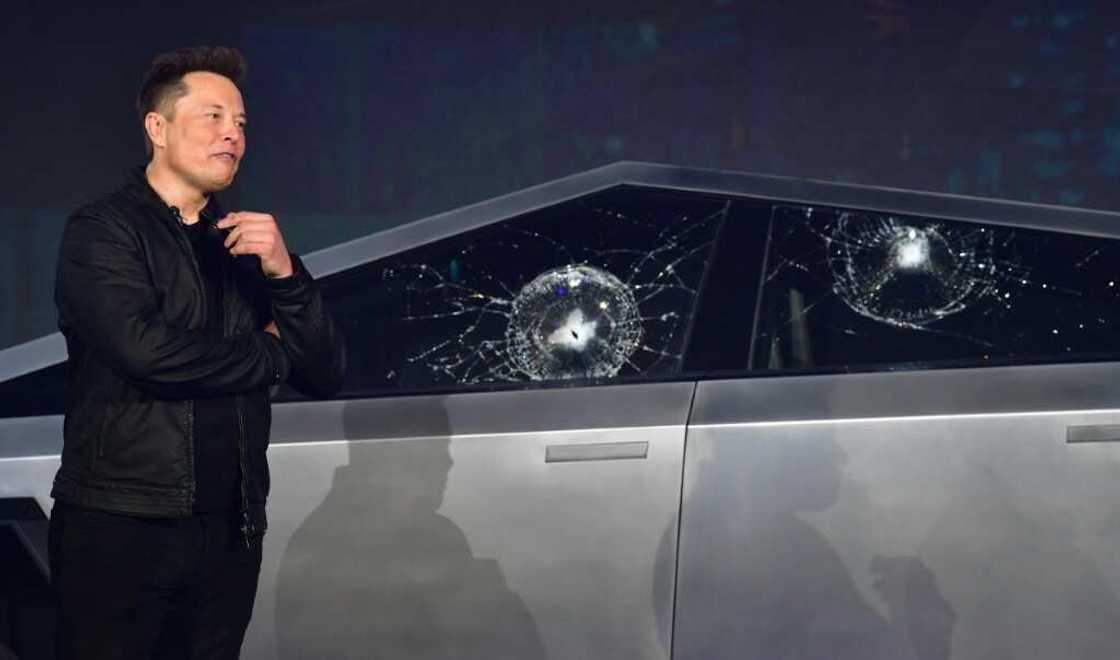 Tesla co-founder and CEO Elon Musk verbally reacts in front of the newly unveiled all-electric battery-powered Tesla Cybertruck with broken glass on windows following a demonstation that did not go as planned on November 21, 2019 at Tesla Design Center in Hawthorne, California Tesla co-founder and CEO Elon Musk verbally reacts in front of the newly unveiled all-electric battery-powered Tesla Cybertruck with broken glass on windows following a demonstation that did not go as planned on November 21, 2019 at Tesla Design Center in Hawthorne, California