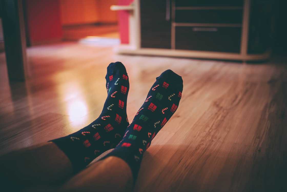 A close-up of a person on coloured socks