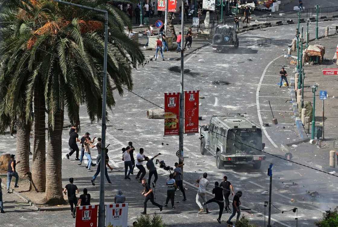 Young Palestinians engage in running battles with police in Nablus on Tuesday turning the heart of the West Bank city into a combat zone Young Palestinians engage in running battles with police in Nablus on Tuesday turning the heart of the West Bank city into a combat zone