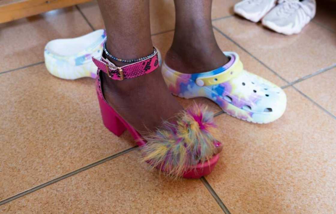 Crocs and feathers: Cool Fawa tries on some of her favourite shoes