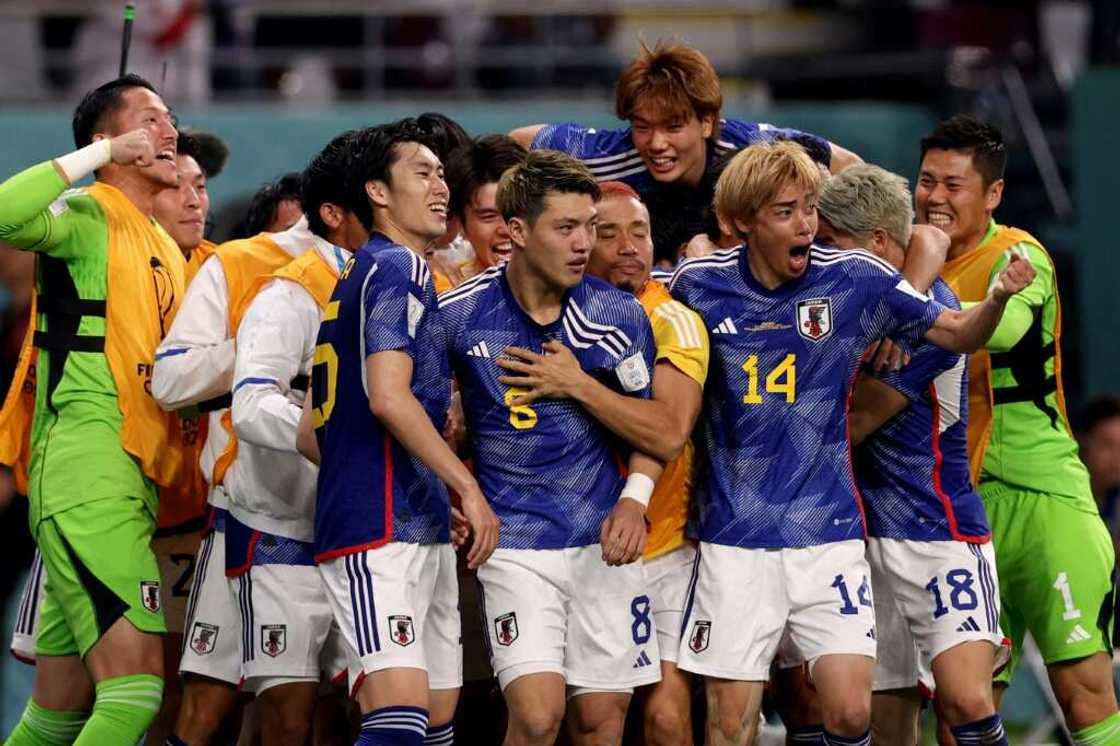 Japan produced a stunning comeback to claim a shock 2-1 win over Germany on Wednesday