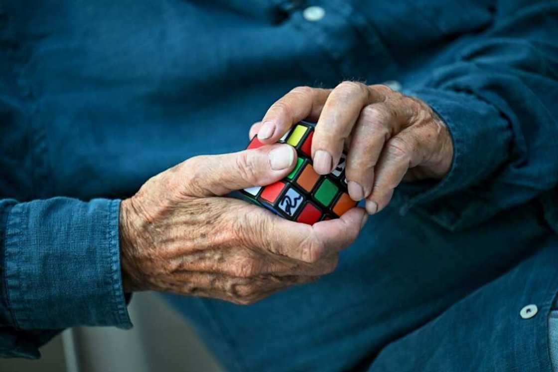 It's what hands are for: Inventor Erno Rubik gets to grip with his famous cube