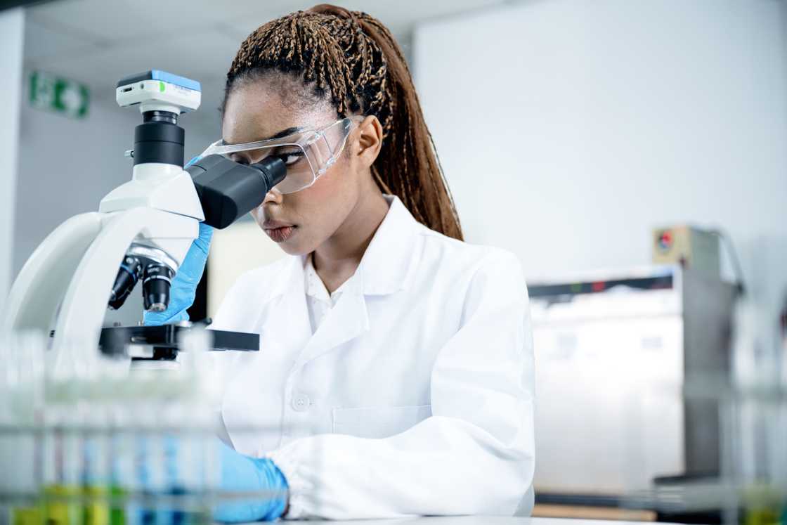 A female scientist in a pharmaceutical laboratory. A female scientist in a pharmaceutical laboratory.