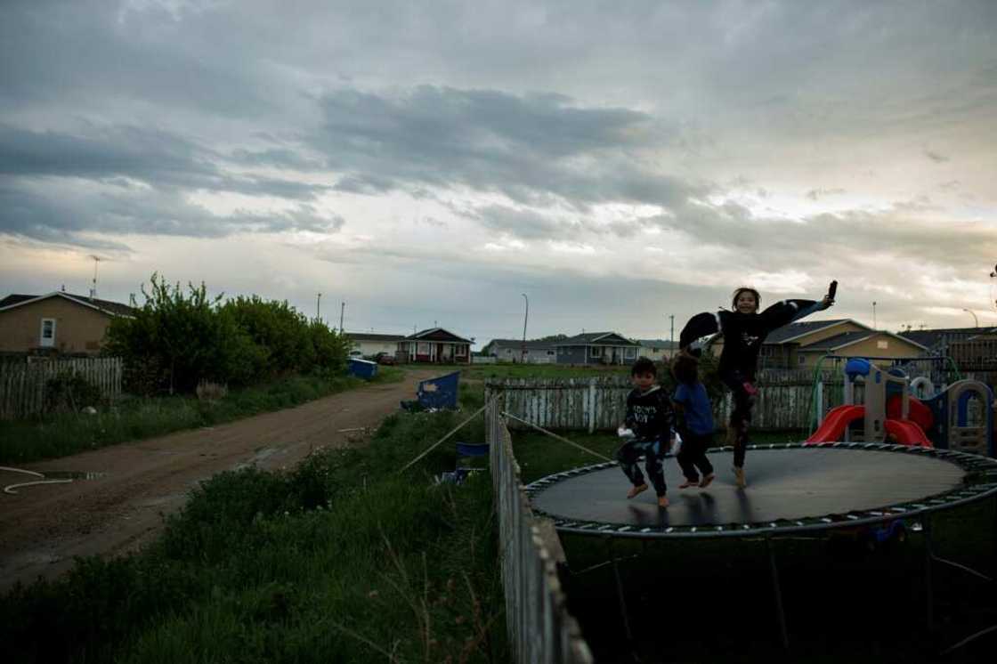 Children on June 7 play on a trampoline in a backyard in the Indigenous community of Maskwacis, Alberta, where Pope Francis is to make a stop during his upcoming visit to Canada Children on June 7 play on a trampoline in a backyard in the Indigenous community of Maskwacis, Alberta, where Pope Francis is to make a stop during his upcoming visit to Canada