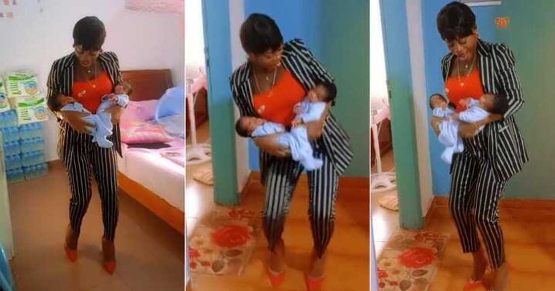 Excited mother dances with her twin babies