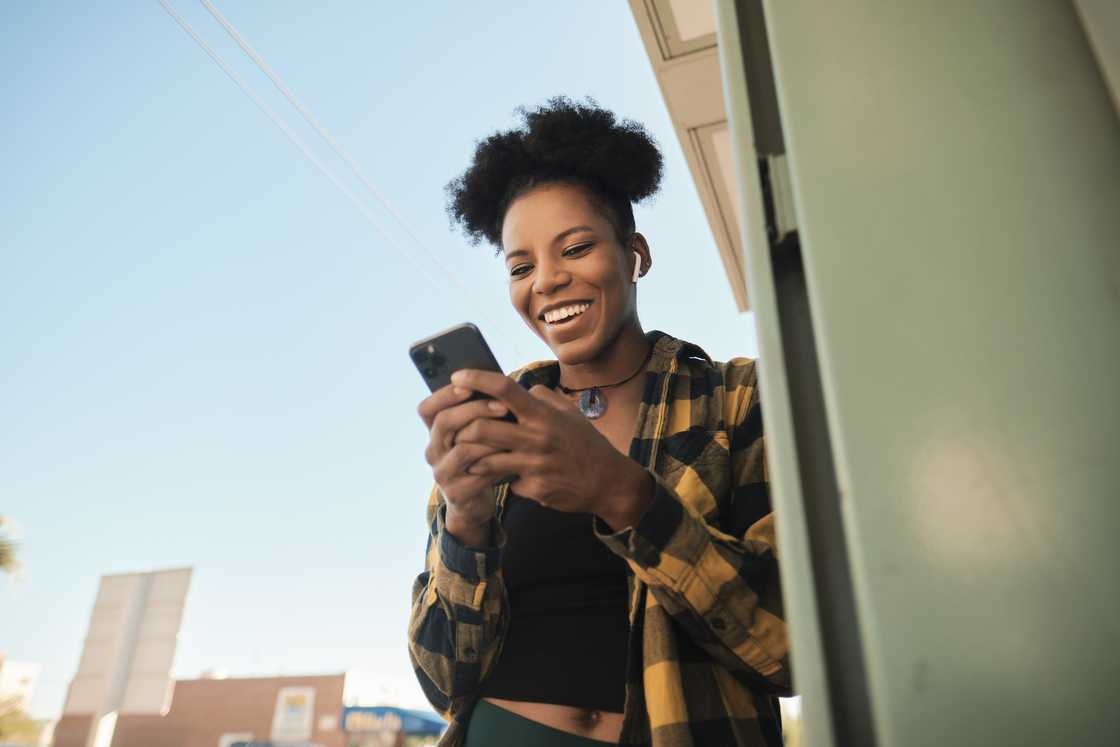 A young woman using a phone A young woman using a phone