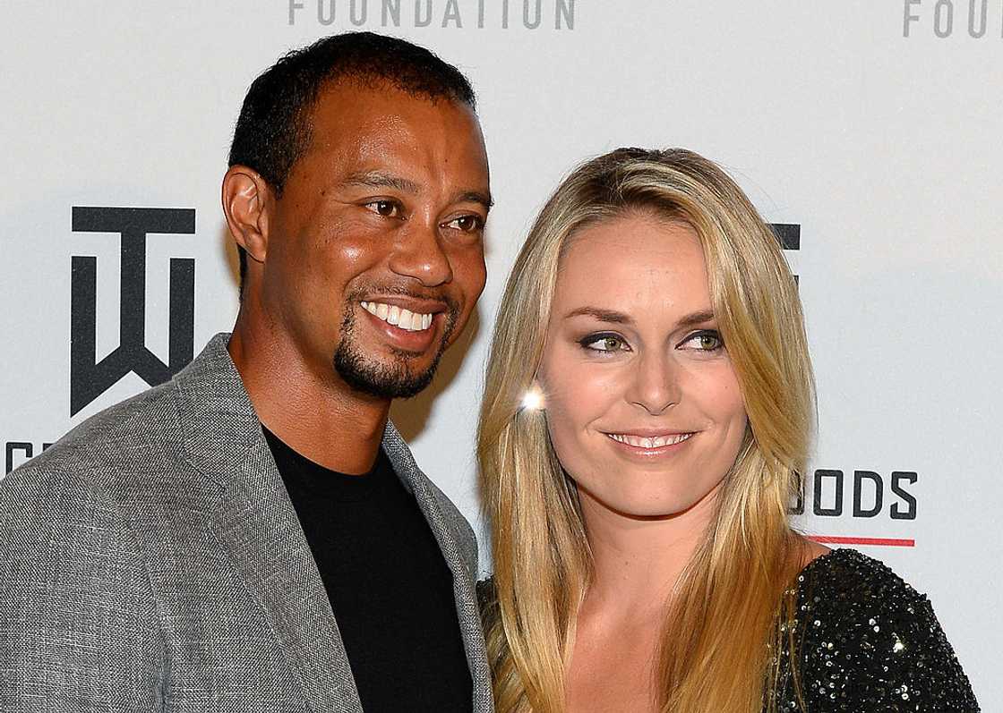 Golfer Tiger Woods (L) and ski racer Lindsey Vonn during Tiger Jam 2014