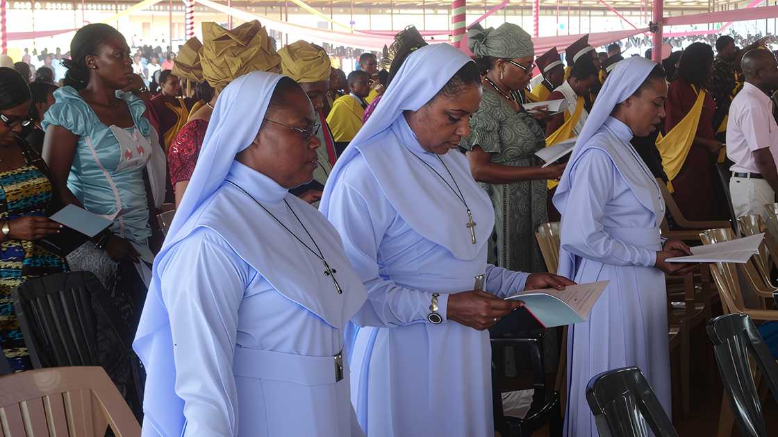 Catholic nuns and congregants during mass Catholic nuns and congregants during mass