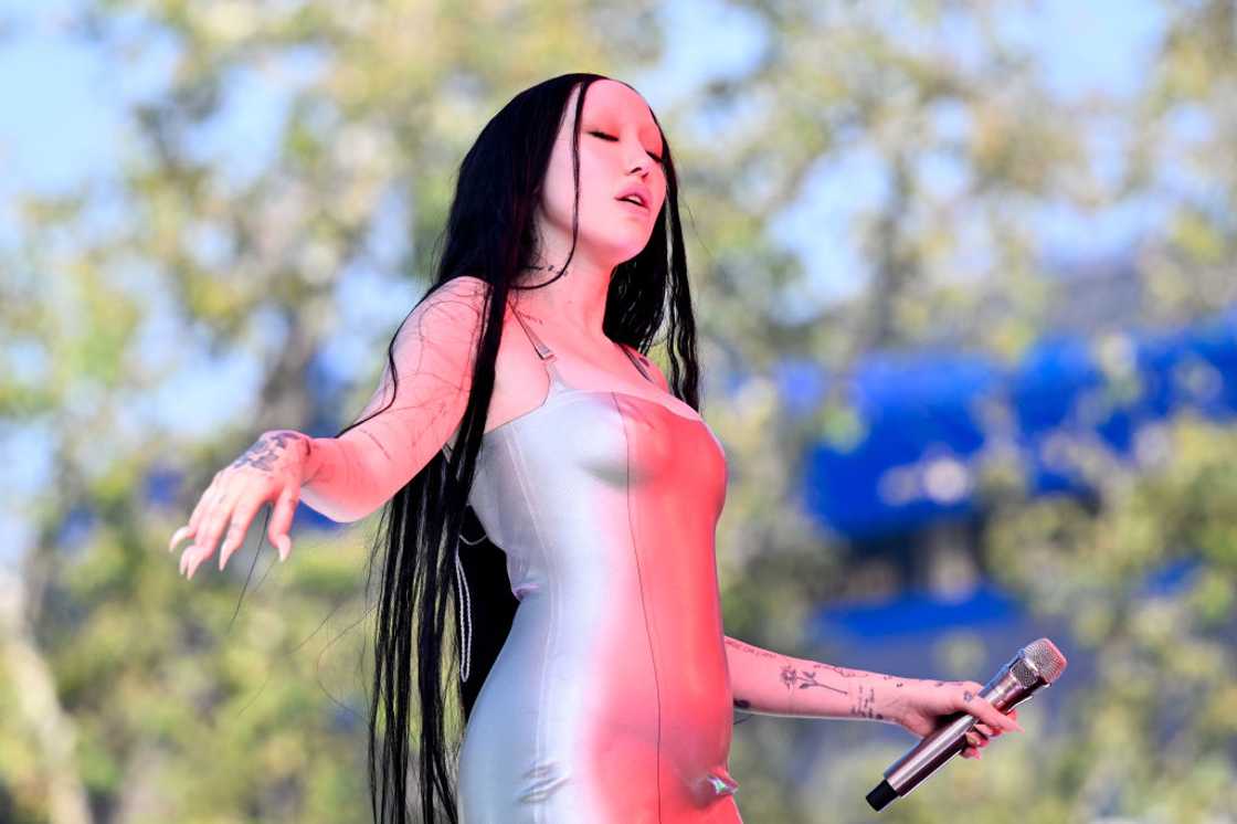 Noah Cyrus closing her eyes as she performs at West Hollywood Park