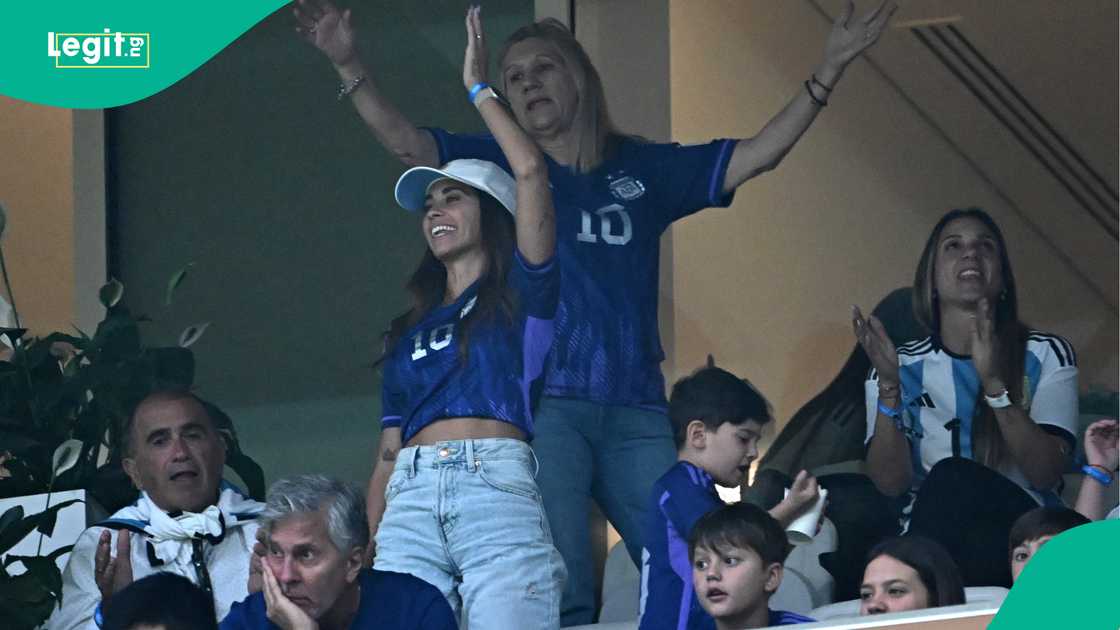 Lionel Messi's wife Antonela Roccuzzo (C), mother Celia Maria Cuccittini (C-R) and father Jorge Messi (C-L) in the stands at the Qatar 2022 World Cup final. Photo by Anne-Christine POUJOULAT