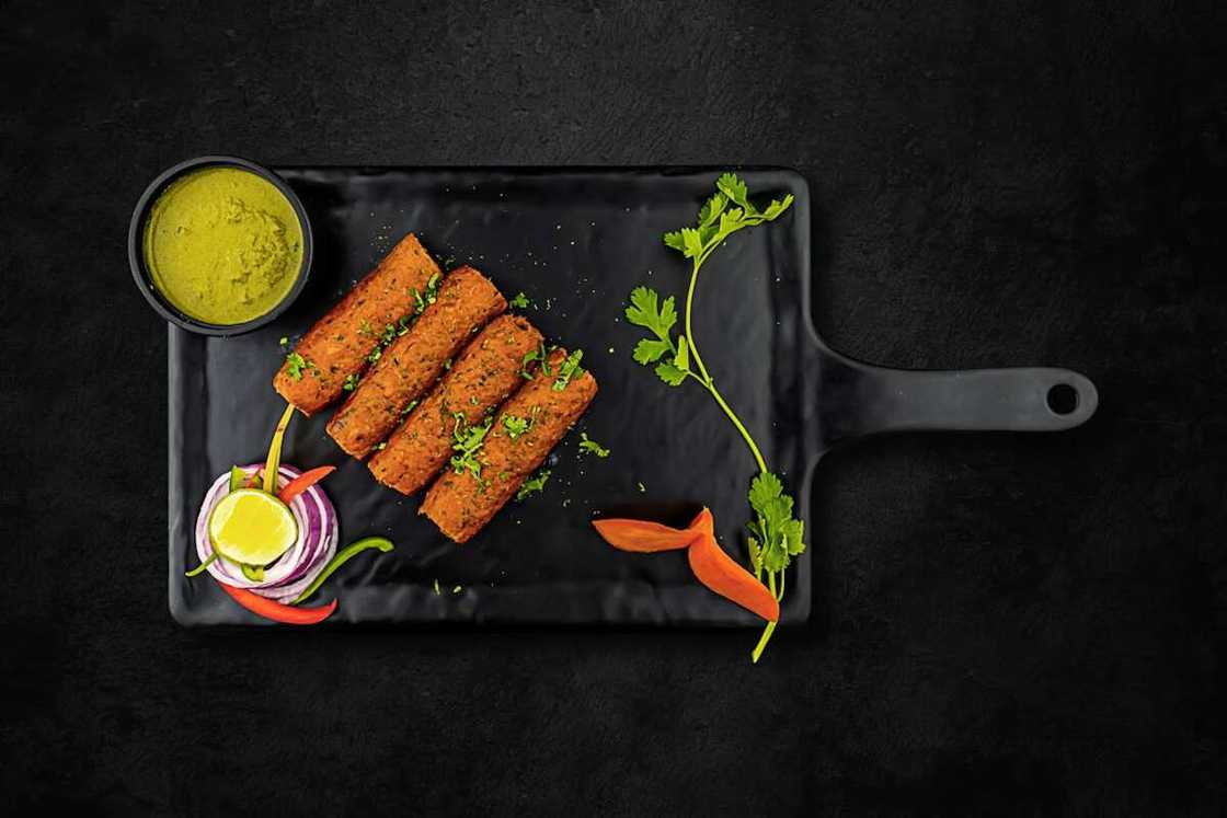 Food placed on a black tray Food placed on a black tray