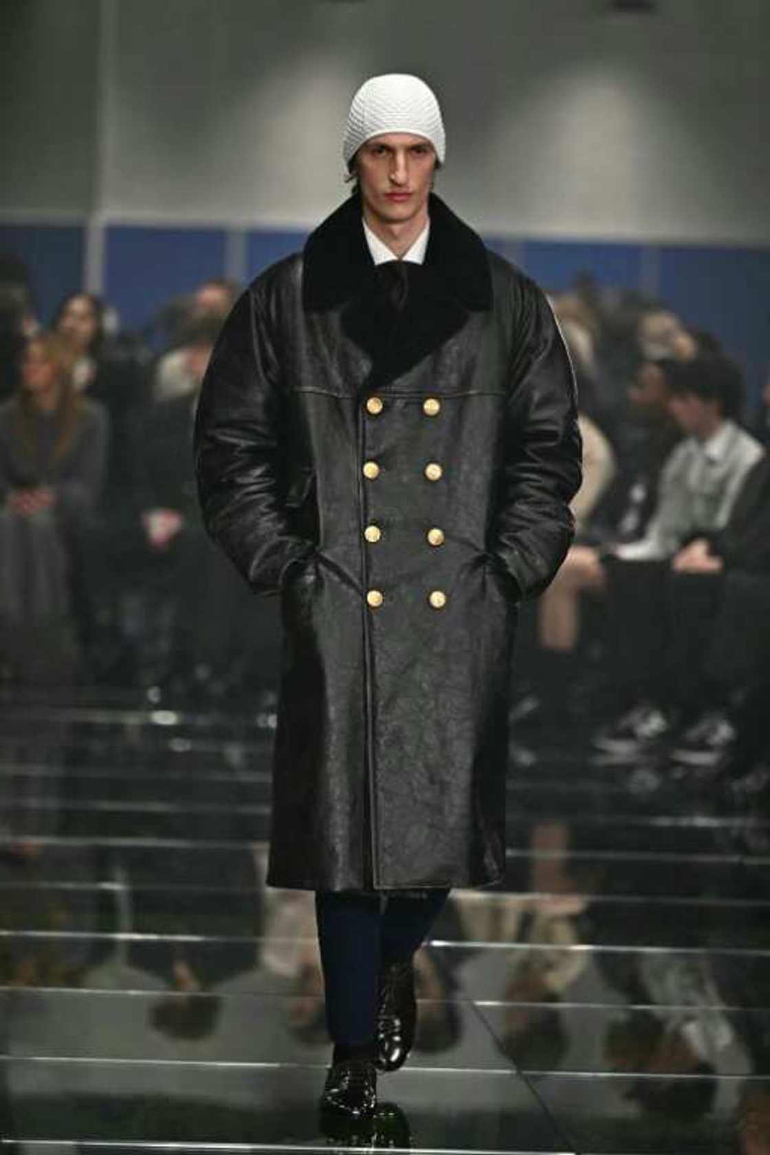 Big gold buttons on large parkas were a feature of the Prada collection Big gold buttons on large parkas were a feature of the Prada collection