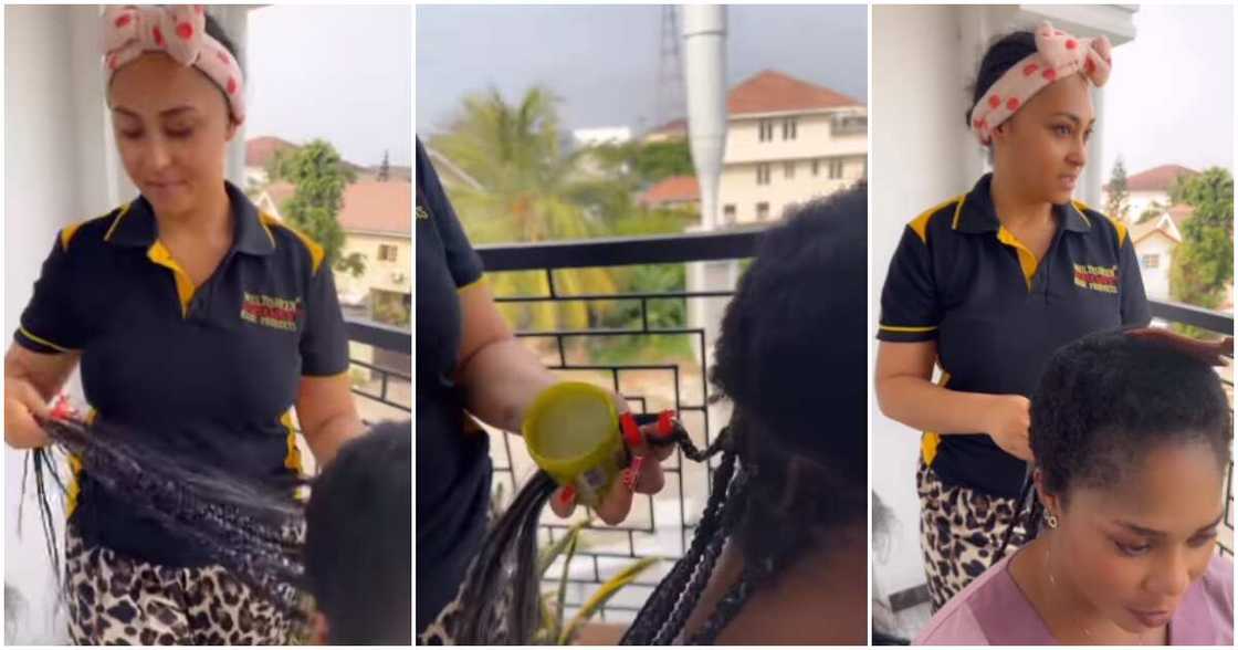 Rosy Meurer braids son's nanny's hair. Rosy Meurer braids son's nanny's hair.