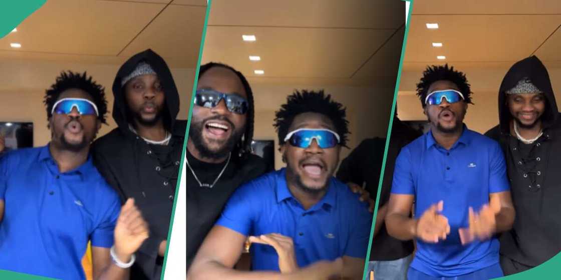 Kizz Daniel and Iyanya dancing to Nasboi's Umbrella song in video. Kizz Daniel and Iyanya dancing to Nasboi's Umbrella song in video.