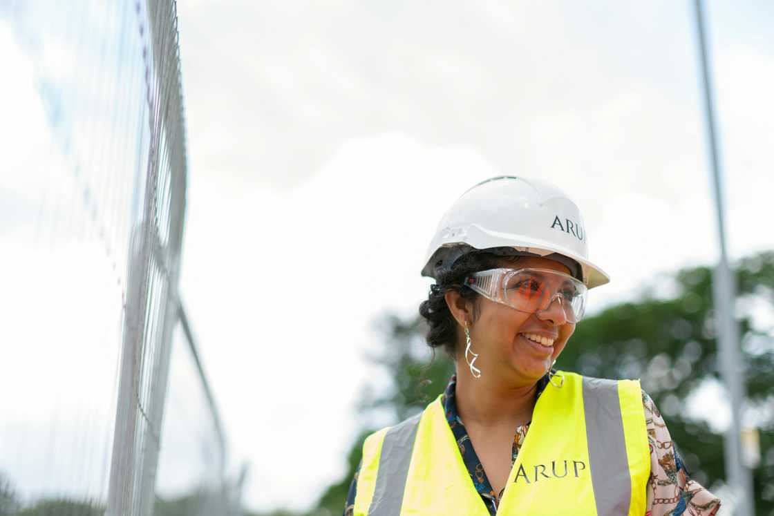 A female engineer smiling A female engineer smiling