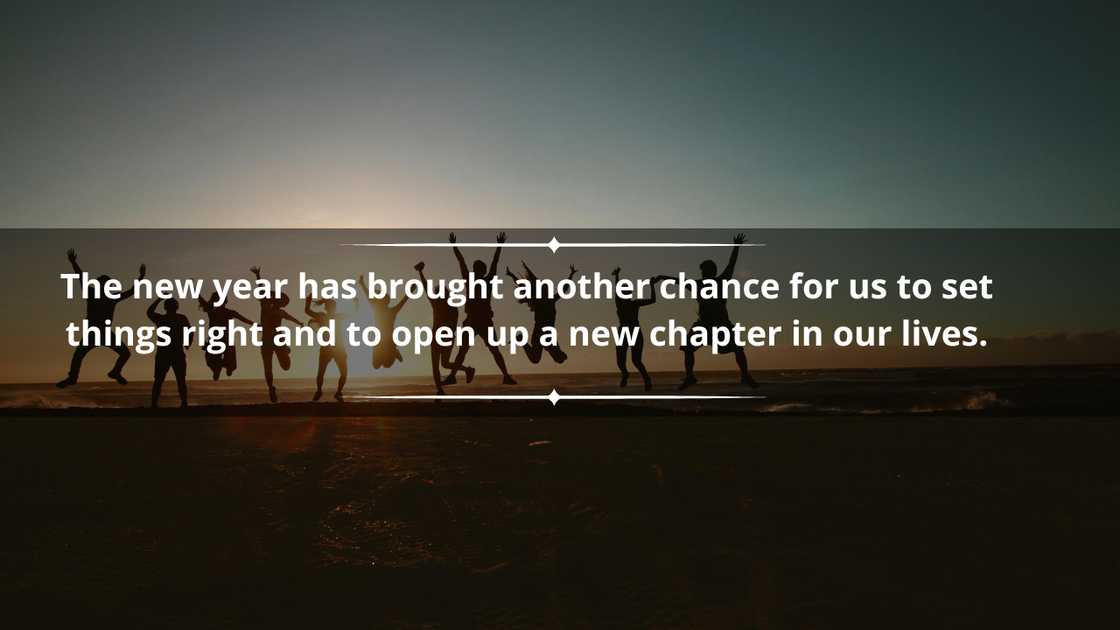 People celebrating New Year jumping on the beach at dawn People celebrating New Year jumping on the beach at dawn