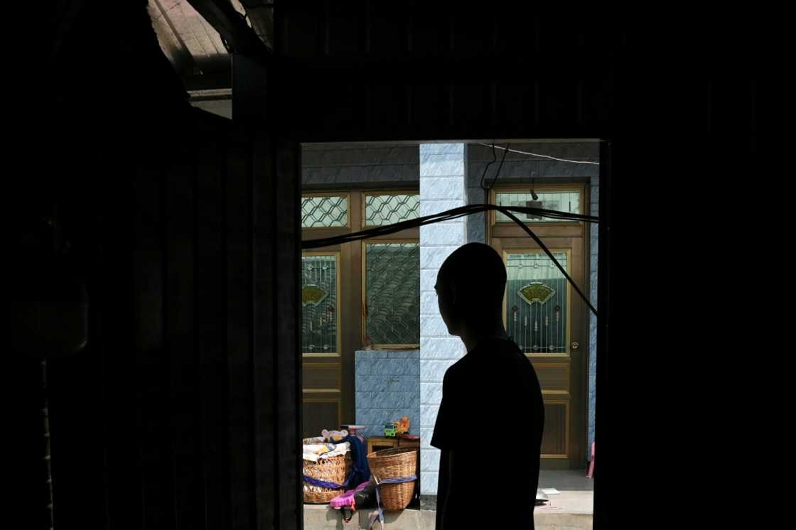 Freed: Sun, 25, whose identity AFP are protecting, back in his village in Yunnan, China Freed: Sun, 25, whose identity AFP are protecting, back in his village in Yunnan, China