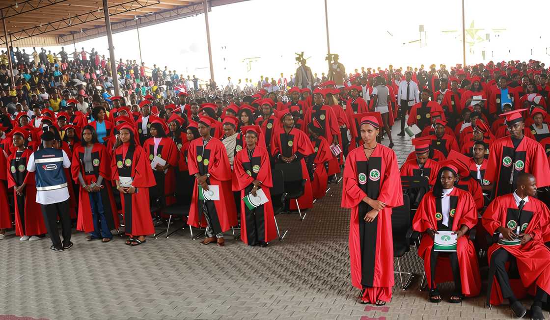 Students wearing red and black matriculation gowns at the University of Africa, Toru-orua. Students wearing red and black matriculation gowns at the University of Africa, Toru-orua.