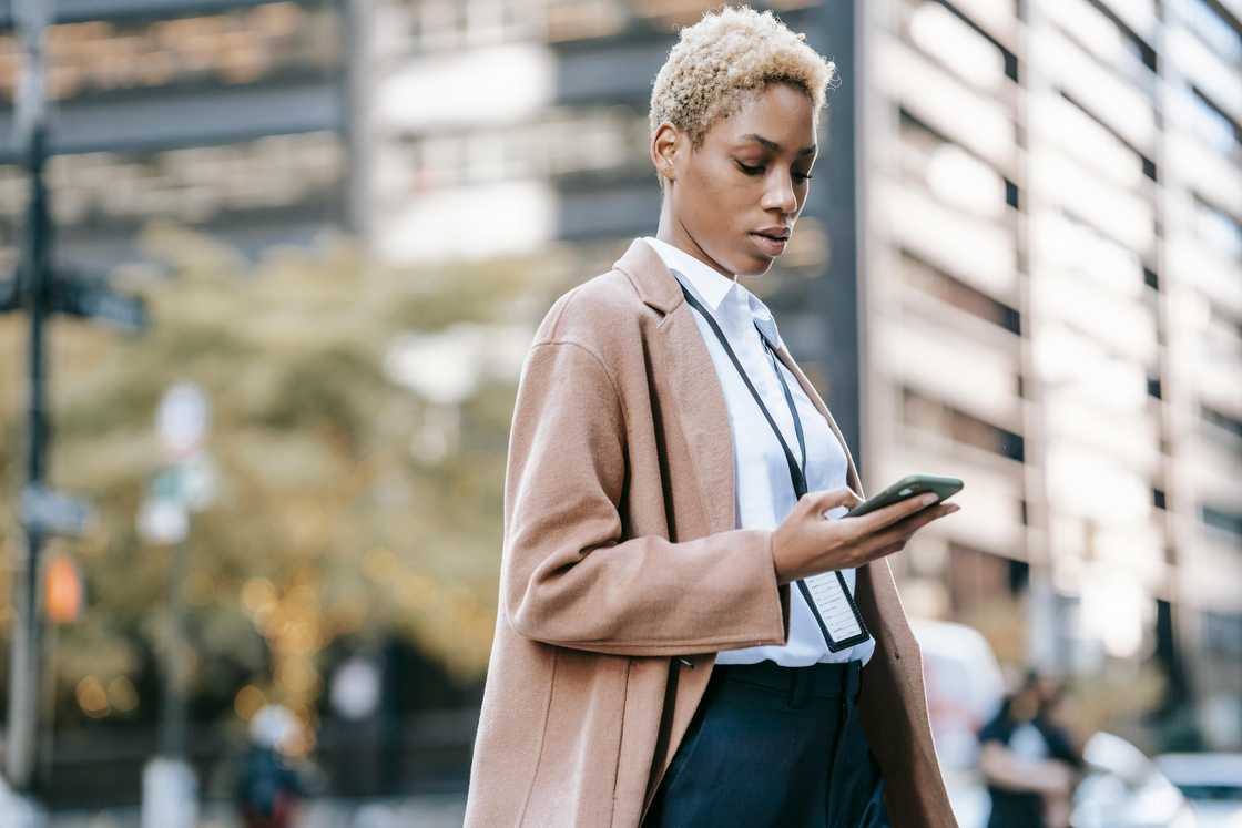 A lady using her smart phone A lady using her smart phone