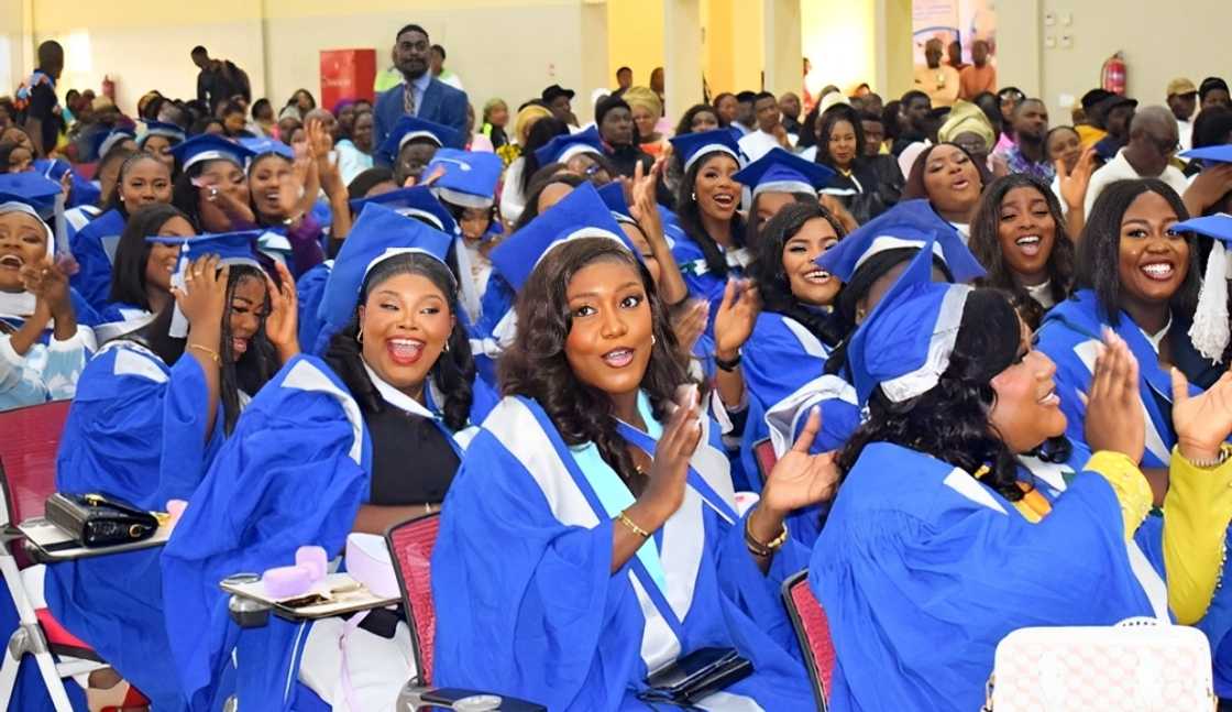 Students cheering during graduation Students cheering during graduation