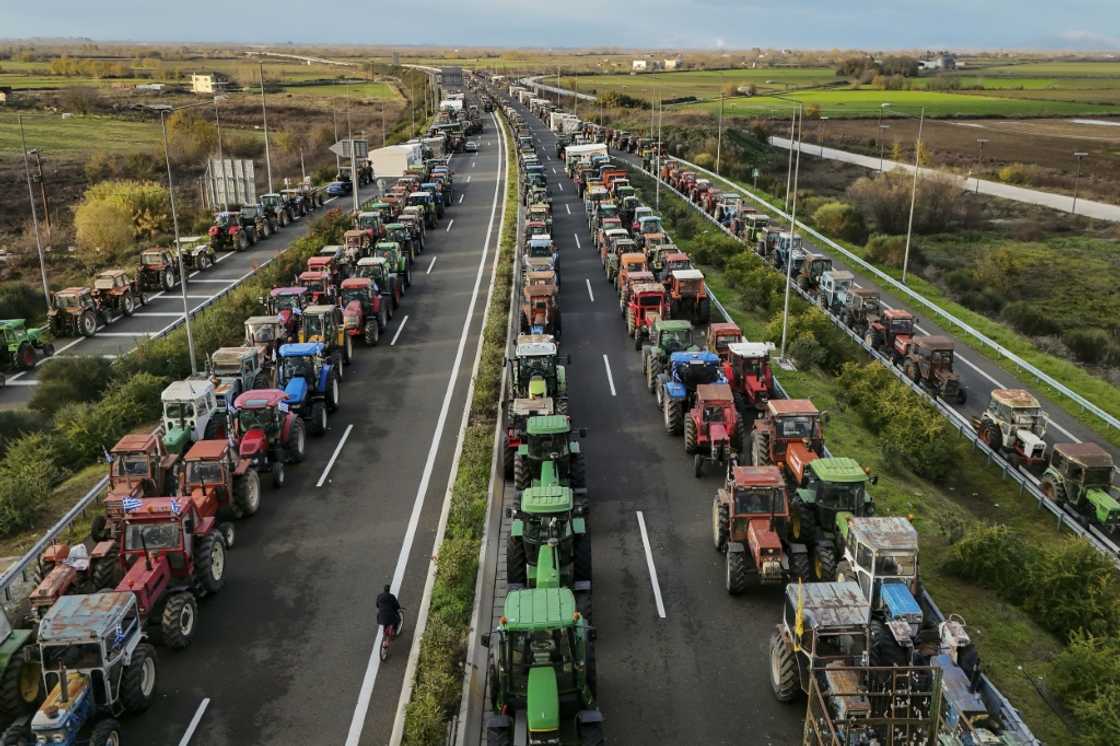 Farmers block the highway outside the central Greek city of Karditsa on December 8, 2025 to demand swifter access to EU subsidies Farmers block the highway outside the central Greek city of Karditsa on December 8, 2025 to demand swifter access to EU subsidies