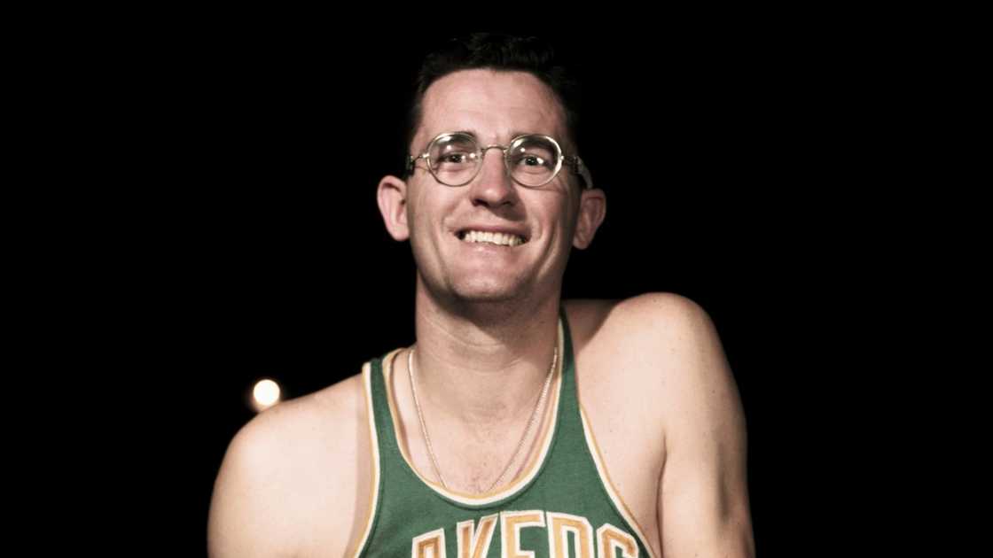 Minneapolis Lakers basketball player George Mikan poses for a portrait.