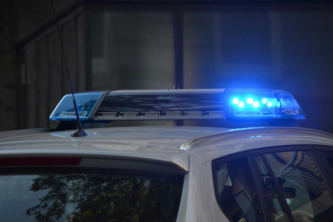 An emergency vehicle with blue light turned on An emergency vehicle with blue light turned on