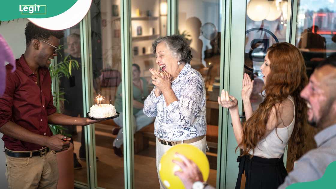 A senior businesswoman being celebrated in the office on her workaversary