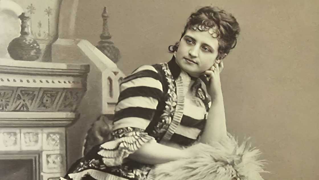 A portrait of Teresa Carreño in a stripped dress. A portrait of Teresa Carreño in a stripped dress.