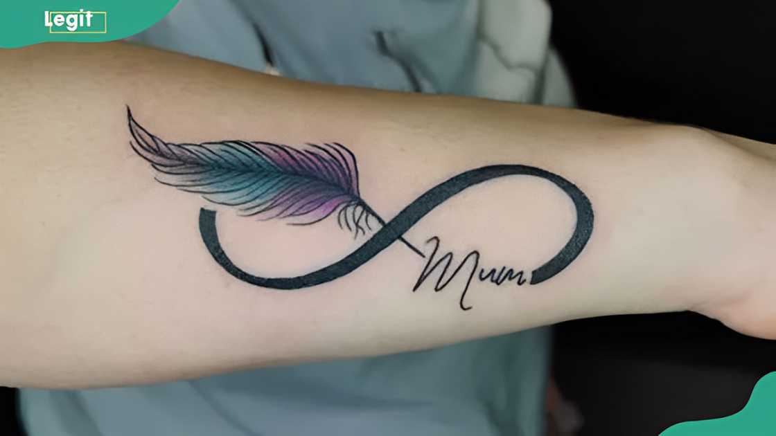 Freedom feather and name tattoo Freedom feather and name tattoo