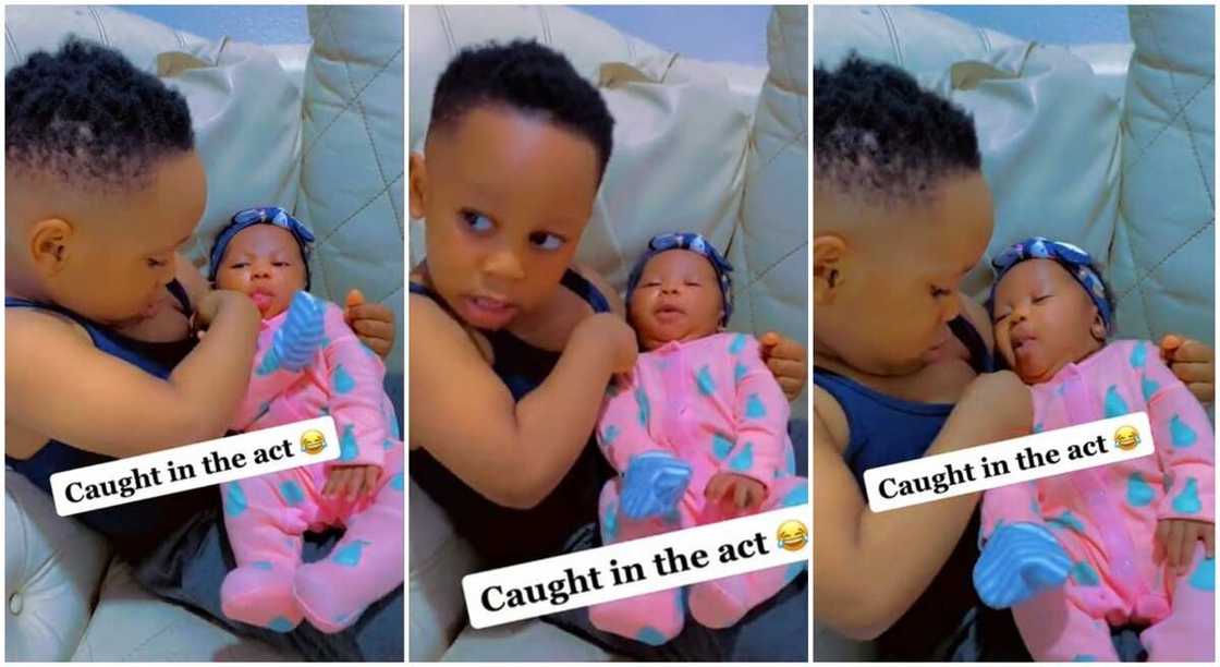 Photos of a Nigerian boy cuddling his baby sister and trying hard to breastfeed her. Photos of a Nigerian boy cuddling his baby sister and trying hard to breastfeed her.