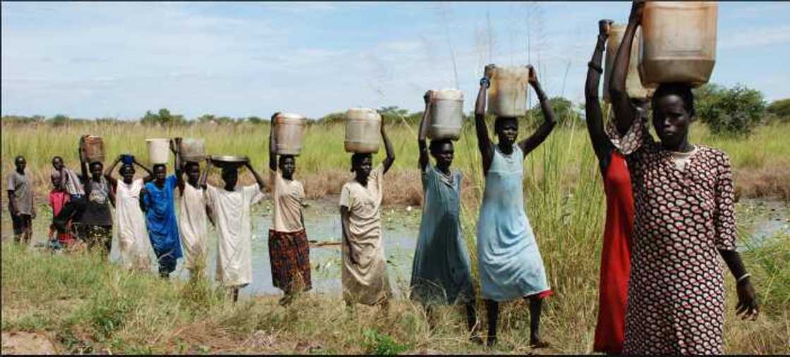 South Sudan women carrying water South Sudan women carrying water