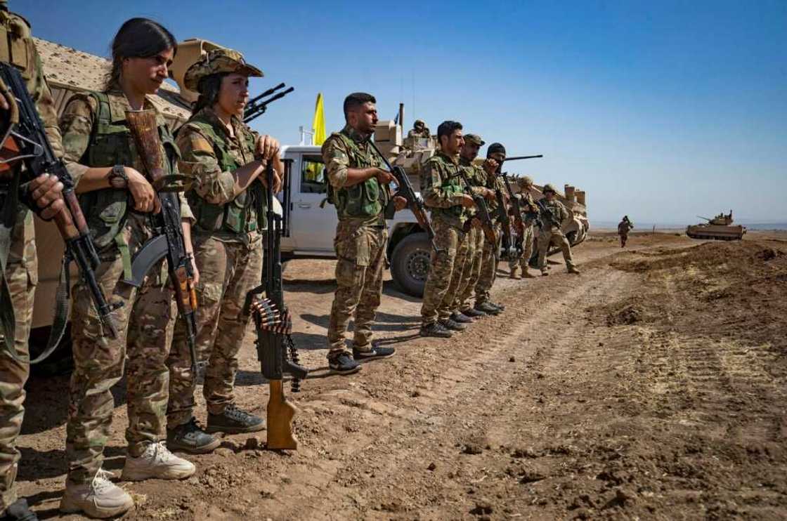 Syrian Democratic Forces fighters at a joint exercise with the US-led coalition against the Islamic State group in northeastern Hasakah province on September 7, 2022 Syrian Democratic Forces fighters at a joint exercise with the US-led coalition against the Islamic State group in northeastern Hasakah province on September 7, 2022