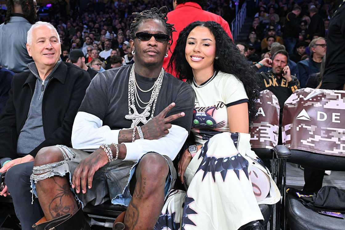 Young Thug and Mariah the Scientist attend a basketball game