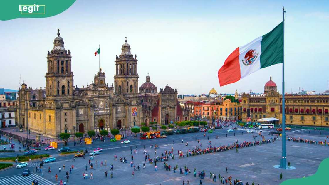 The Mexican flag flies over the Zocalo, the main square in Mexico City