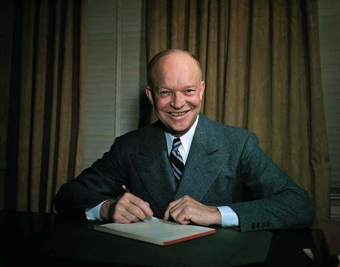 Dwight Eisenhower seated at a desk. Dwight Eisenhower seated at a desk.
