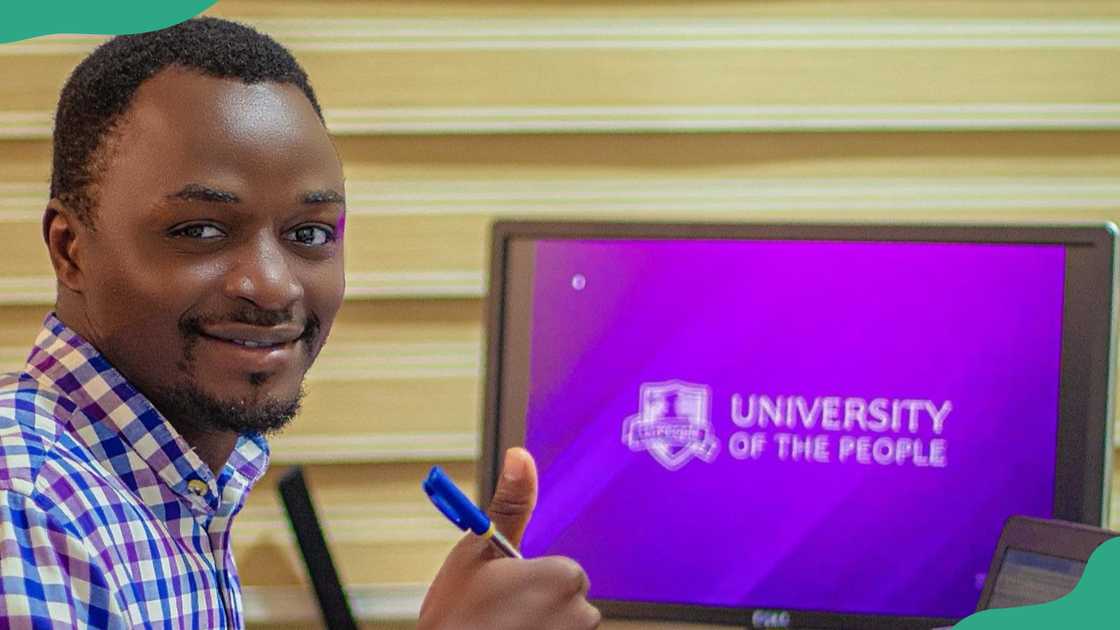 A UoPeople student smiles as he studies A UoPeople student smiles as he studies