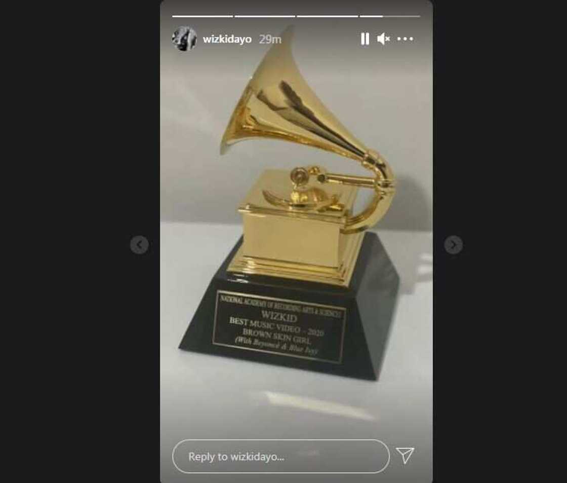 Wizkid receives his Grammy award plaque. Wizkid receives his Grammy award plaque.